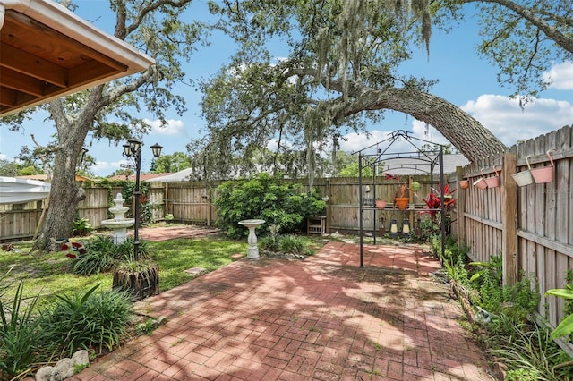 7470 Canterbury St, Spring Hill, FL 34606 - fenced backyard with a patio area and a gazebo
