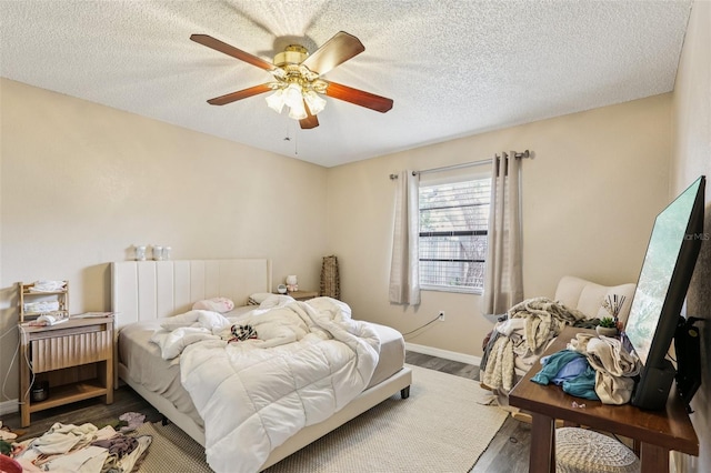 7470 Canterbury St, Spring Hill, FL 34606 - bedroom featuring wood finished floors, a ceiling fan, and a textured ceiling