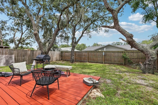 7470 Canterbury St, Spring Hill, FL 34606 - wooden deck featuring a fenced backyard and area for grilling
