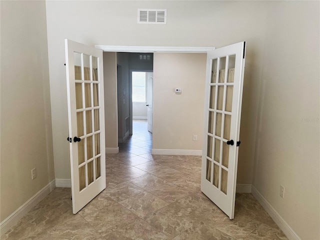 5082 Inshore Landings Dr, Apollo Beach, FL 33572 - hallway featuring french doors and baseboards