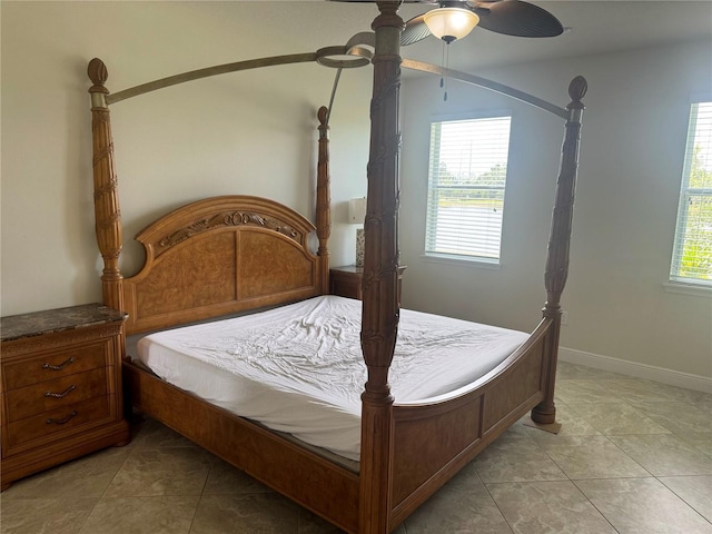5082 Inshore Landings Dr, Apollo Beach, FL 33572 - bedroom with multiple windows, light tile patterned flooring, and a ceiling fan