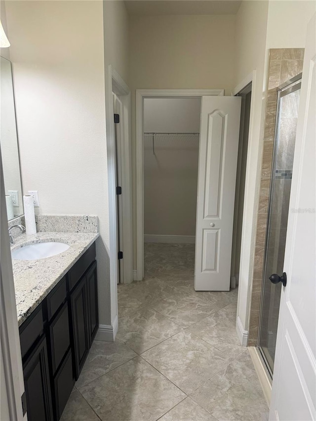 5082 Inshore Landings Dr, Apollo Beach, FL 33572 - full bath featuring a stall shower, vanity, and a walk in closet