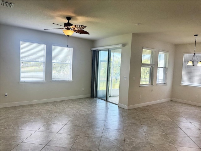 5082 Inshore Landings Dr, Apollo Beach, FL 33572 - spare room with a ceiling fan, a textured ceiling, and light tile patterned flooring