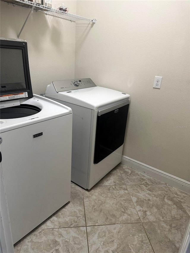 5082 Inshore Landings Dr, Apollo Beach, FL 33572 - washroom featuring independent washer and dryer and baseboards