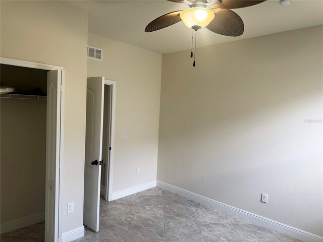 5082 Inshore Landings Dr, Apollo Beach, FL 33572 - unfurnished bedroom featuring a closet and ceiling fan