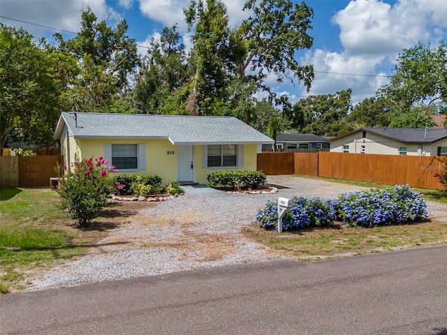 932 W Wheeler Rd, Brandon, FL 33510 - view of front of house featuring driveway and stucco siding