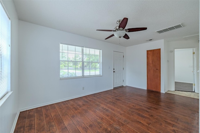 932 W Wheeler Rd, Brandon, FL 33510 - unfurnished room featuring dark wood-type flooring, ceiling fan, and a textured ceiling