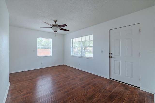932 W Wheeler Rd, Brandon, FL 33510 - unfurnished room featuring dark wood-style floors, ceiling fan, and a textured ceiling