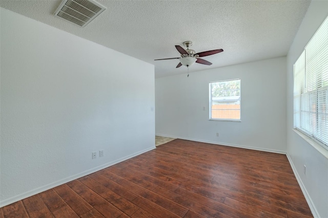 932 W Wheeler Rd, Brandon, FL 33510 - unfurnished room with dark wood-style floors, a ceiling fan, and a textured ceiling