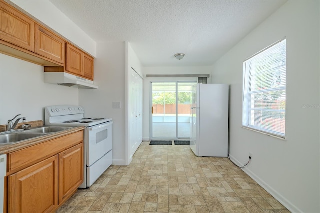 932 W Wheeler Rd, Brandon, FL 33510 - kitchen with white appliances, under cabinet range hood, a textured ceiling, light countertops, and stone finish floors