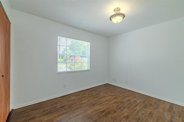 932 W Wheeler Rd, Brandon, FL 33510 - unfurnished room with dark wood-style flooring and baseboards