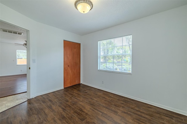 932 W Wheeler Rd, Brandon, FL 33510 - unfurnished bedroom featuring wood finished floors, a closet, and a textured ceiling