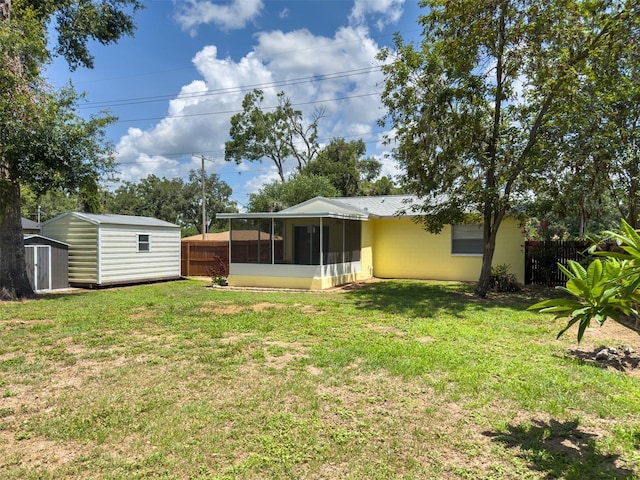 932 W Wheeler Rd, Brandon, FL 33510 - view of yard with a sunroom and a shed