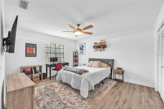 832 Birdie Way, Apollo Beach, FL 33572 - bedroom featuring light wood-style flooring and ceiling fan