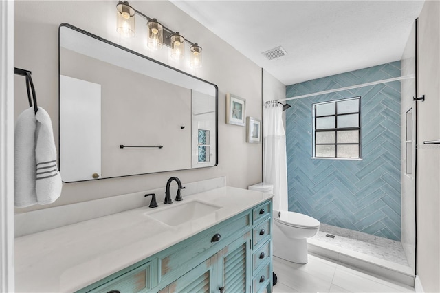 832 Birdie Way, Apollo Beach, FL 33572 - bathroom with vanity, a tile shower, and tile patterned floors