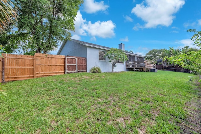 832 Birdie Way, Apollo Beach, FL 33572 - back of property with a fenced backyard and a chimney