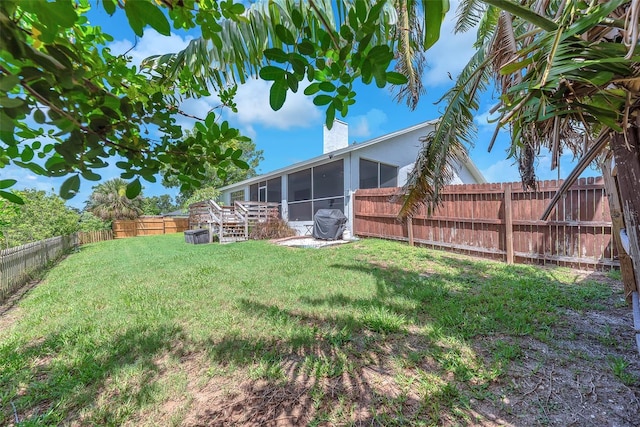 832 Birdie Way, Apollo Beach, FL 33572 - fenced backyard featuring a sunroom