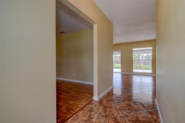 14047 Briardale Ln, Tampa, FL 33618 - hallway with a textured ceiling and a textured wall
