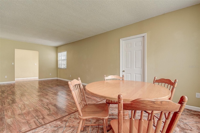 14047 Briardale Ln, Tampa, FL 33618 - dining space featuring light wood finished floors and a textured ceiling