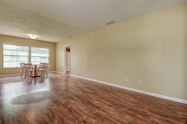 14047 Briardale Ln, Tampa, FL 33618 - dining area featuring dark wood finished floors and a textured ceiling