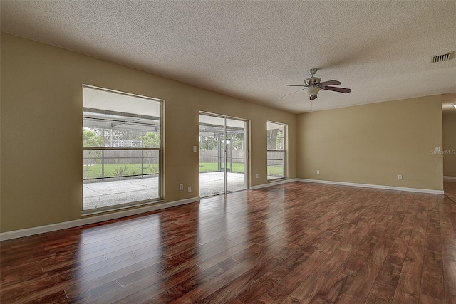 14047 Briardale Ln, Tampa, FL 33618 - spare room featuring wood finished floors, ceiling fan, and a textured ceiling
