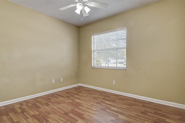 14047 Briardale Ln, Tampa, FL 33618 - unfurnished room featuring wood finished floors, ceiling fan, and a textured ceiling