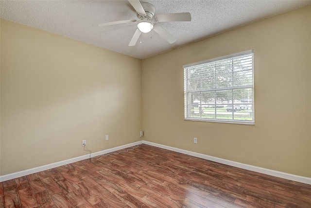 14047 Briardale Ln, Tampa, FL 33618 - unfurnished room with plenty of natural light, wood finished floors, a ceiling fan, and a textured ceiling