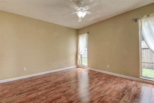 14047 Briardale Ln, Tampa, FL 33618 - unfurnished room featuring wood finished floors, a textured ceiling, and ceiling fan