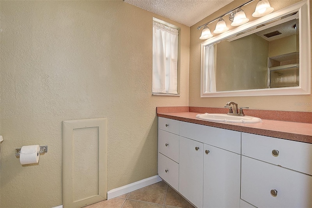 14047 Briardale Ln, Tampa, FL 33618 - full bath featuring vanity, a textured ceiling, and tile patterned floors