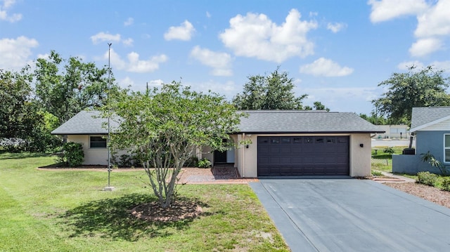 4228 Belle Isle Ct, New Port Richey, FL 34653 - view of front of house with a garage, driveway, a front lawn, and stucco siding