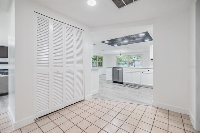 4228 Belle Isle Ct, New Port Richey, FL 34653 - corridor with baseboards and light tile patterned flooring