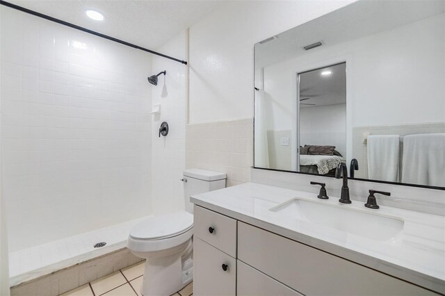 4228 Belle Isle Ct, New Port Richey, FL 34653 - bathroom with ensuite bath, a tile shower, vanity, recessed lighting, and tile patterned flooring
