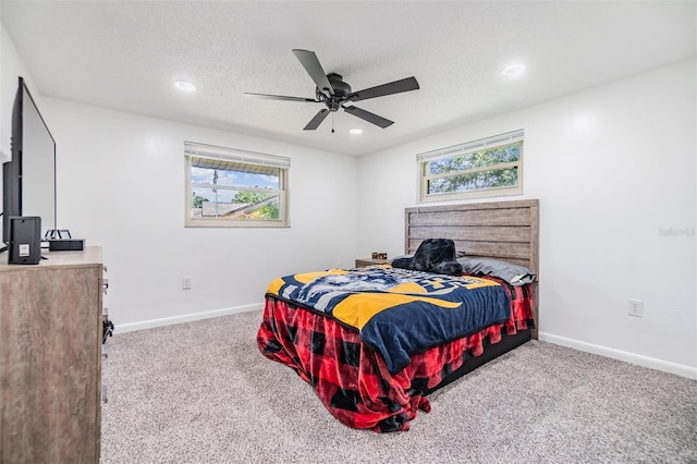 4228 Belle Isle Ct, New Port Richey, FL 34653 - carpeted bedroom featuring multiple windows, recessed lighting, a ceiling fan, and a textured ceiling