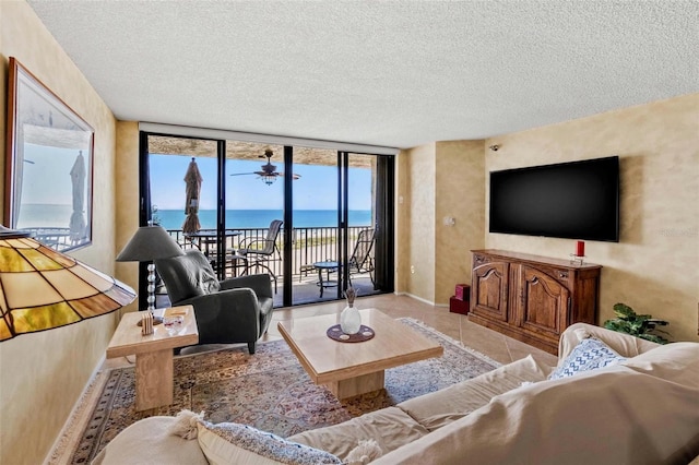1290 Gulf Blvd Unit 702, Clearwater Beach, FL 33767 - living area with a textured ceiling and tile patterned floors