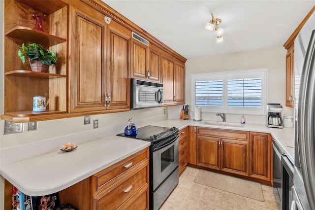 1290 Gulf Blvd Unit 702, Clearwater Beach, FL 33767 - kitchen with appliances with stainless steel finishes, open shelves, brown cabinets, and light countertops