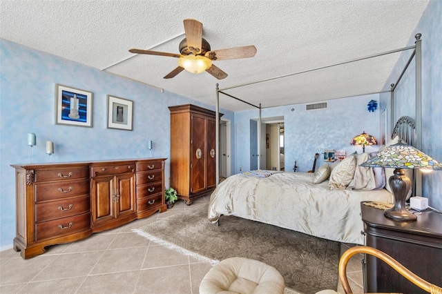 1290 Gulf Blvd Unit 702, Clearwater Beach, FL 33767 - bedroom with a textured ceiling, light tile patterned floors, and a ceiling fan