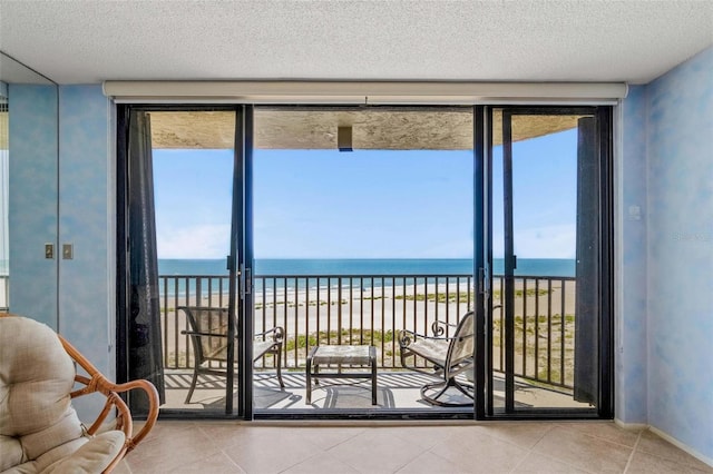 1290 Gulf Blvd Unit 702, Clearwater Beach, FL 33767 - sunroom / solarium featuring view of water and beach and healthy amount of natural light