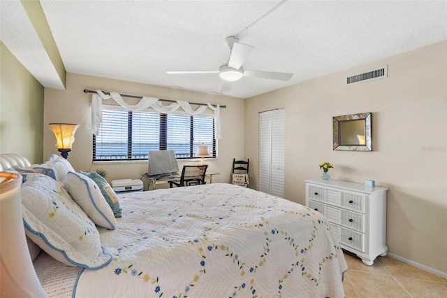 1290 Gulf Blvd Unit 702, Clearwater Beach, FL 33767 - bedroom with light tile patterned floors and a ceiling fan