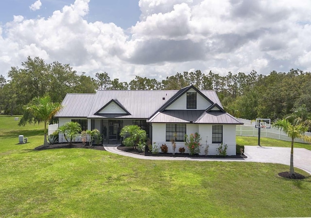 7725 235th St E, Myakka City, FL 34251 - view of front of house featuring a metal roof and stucco siding