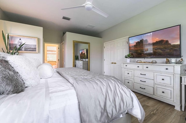 7725 235th St E, Myakka City, FL 34251 - bedroom featuring dark wood-style flooring, a ceiling fan, and ensuite bath