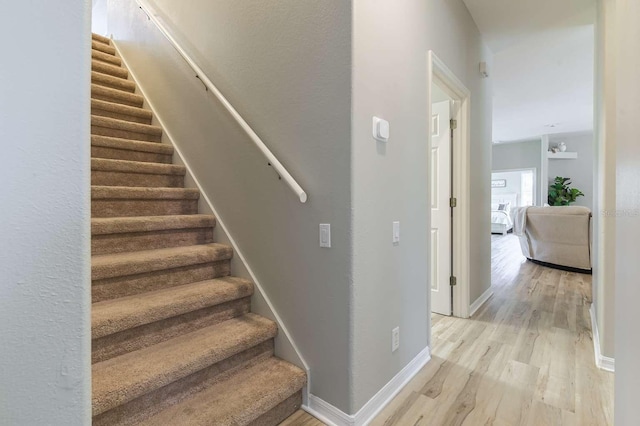 7725 235th St E, Myakka City, FL 34251 - stairway with wood finished floors and baseboards