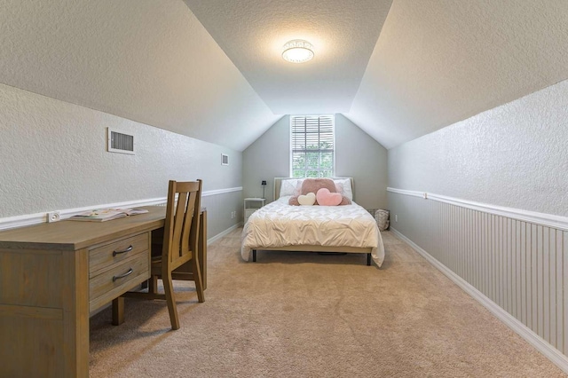7725 235th St E, Myakka City, FL 34251 - carpeted bedroom featuring a textured wall, a textured ceiling, and lofted ceiling