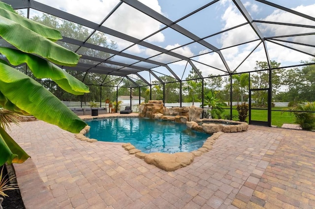 7725 235th St E, Myakka City, FL 34251 - view of swimming pool with a patio area, a pool with connected hot tub, and glass enclosure