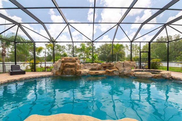 7725 235th St E, Myakka City, FL 34251 - view of swimming pool featuring glass enclosure and a pool with connected hot tub