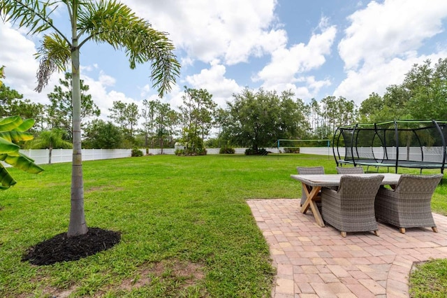 7725 235th St E, Myakka City, FL 34251 - view of yard with a trampoline and a patio area