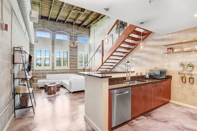 2001 E 2nd Ave Unit 37, Tampa, FL 33605 - kitchen with dishwasher, concrete flooring, dark stone counters, brown cabinetry, and a peninsula