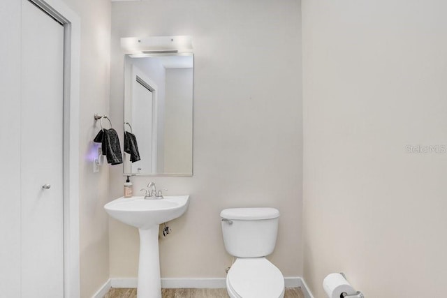 2001 E 2nd Ave Unit 37, Tampa, FL 33605 - bathroom featuring toilet and baseboards
