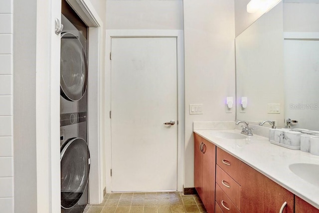 2001 E 2nd Ave Unit 37, Tampa, FL 33605 - bathroom featuring stacked washing machine and dryer and double vanity
