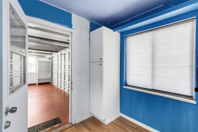 638 La Jolla Ave, Sun City Center, FL 33573 - corridor with baseboards and wood finished floors