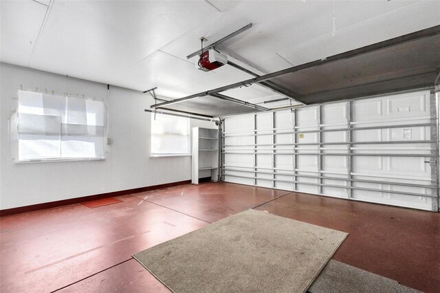 638 La Jolla Ave, Sun City Center, FL 33573 - garage featuring a garage door opener and baseboards